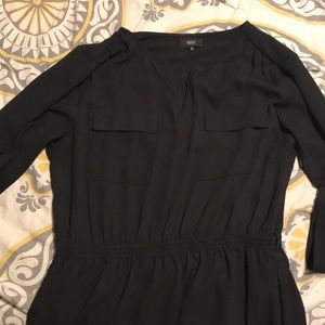 Black dress, length is above the knee.